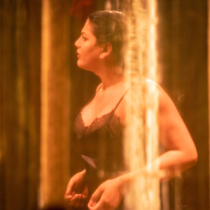 A photograph of Angel Glady wearing a negligee.